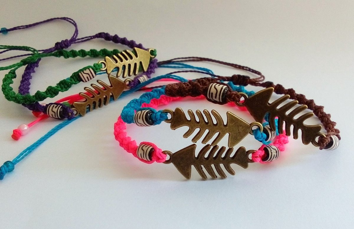Bracelets or anklets, fish bone charms, waxed thread