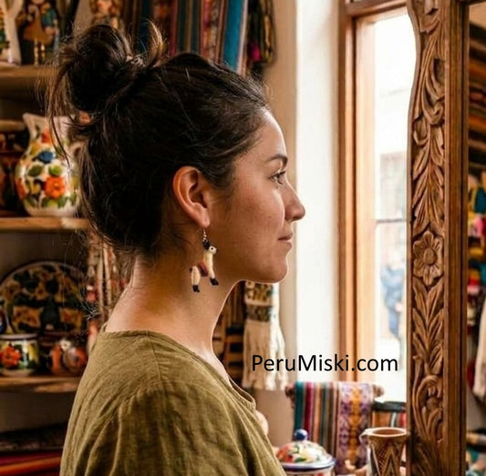 Girl wearing llama earrings by Peru Miski Store